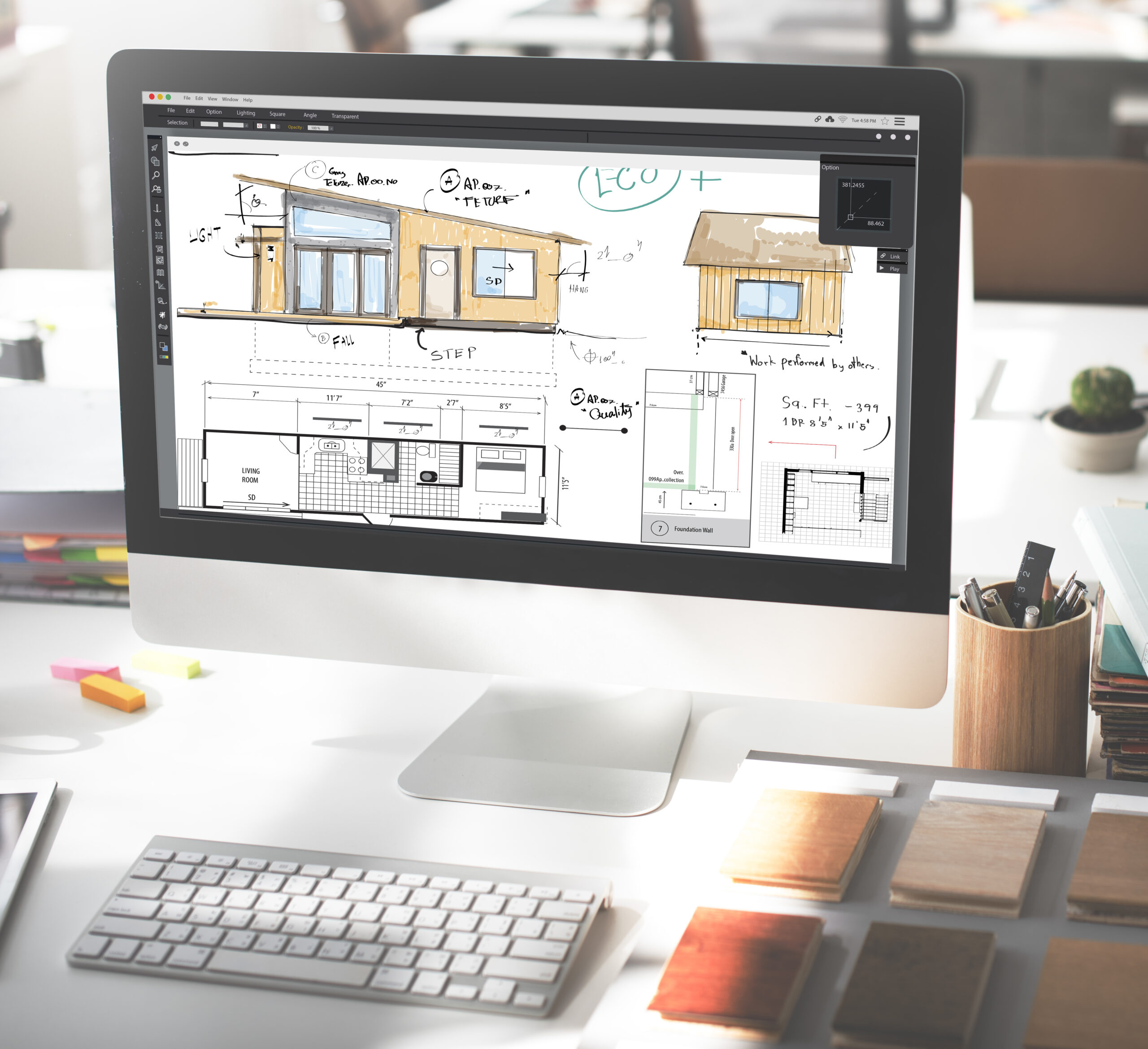 A computer screen displays architectural plans and sketches for a building, enhanced by the use of AI Room Design Tools. The desk holds a keyboard, mouse, books, and wood samples, suggesting interior design or architecture work supported by advanced digital solutions.